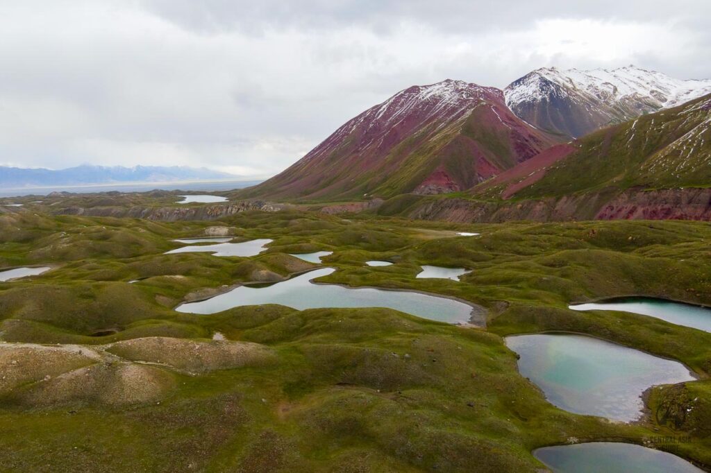 Tulpar Kul lakes and mountains with snow in Alai Valley