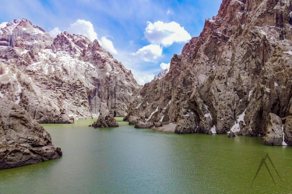 Kel Suu lake surrounded by high cliffs