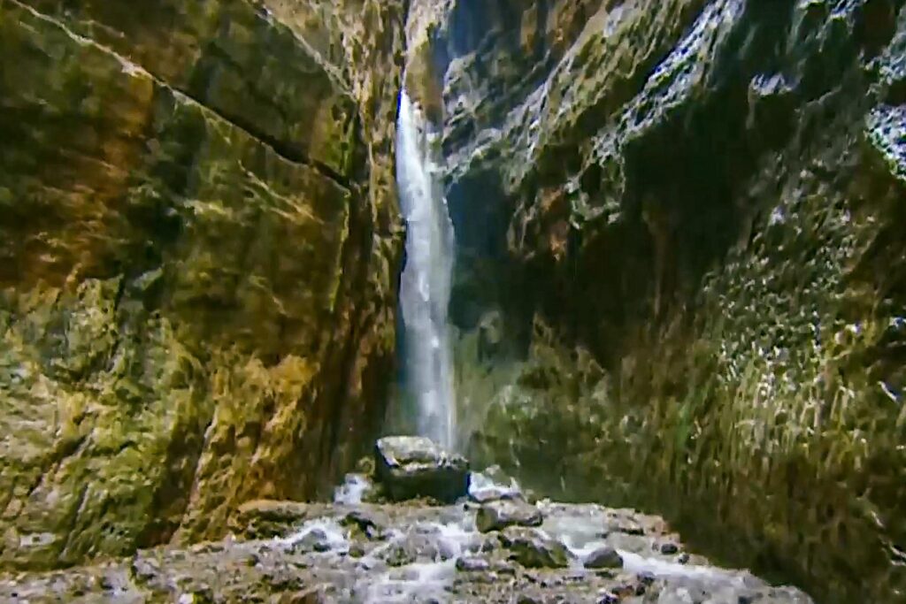 Narrow gorge where Umbar waterfall waters flow in Turkmenistan